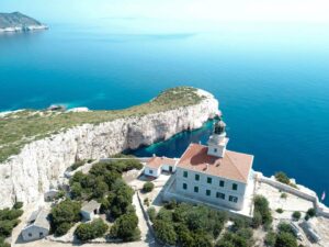 Air picture, remote Island Sušac, lighthouse, trees, Adriatic Sea